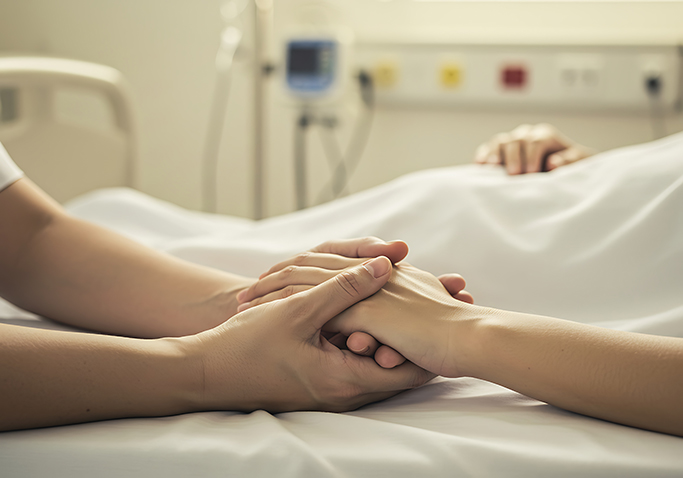 grief being shown with holding hands